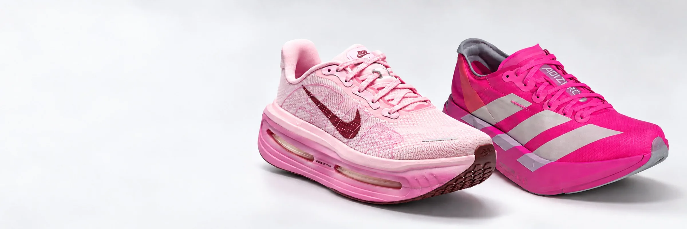 A dupla de treino e prova: o Nike Vomero rosa e o Adidas Adizero Adios Pro pink